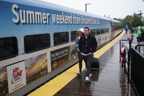 CCB MEDIA PHOTO: Soggy travelers get on board for the last Cape Flyer run of the season Monday