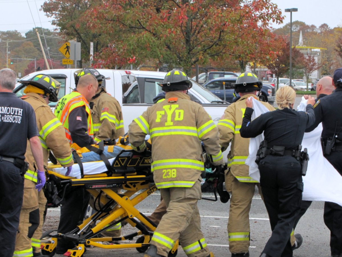 Driver trapped after parking lot crash leaves vehicle on side - CapeCod.com