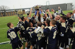 The Massachusetts Maritime Academy men's lacrosse team celebrates their victory Saturday in Throggs Neck, NY. Photo courtesy of MMA Athletics