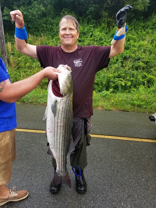 Man gets 3 hooks embedded in his arms while reeling in striped bass at Canal  