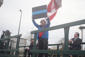 CCB MEDIA PHOTO Rick Zani holds up a symbolic "thin blue line" sign Saturday during the 2nd Cape Cod Cares for Our Cops rally, which he organized